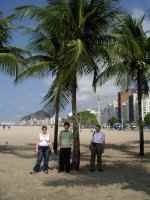 Marie, Marc & Tony under a palm tree on Copacabana Beach, Rio de Janeiro, Brazil