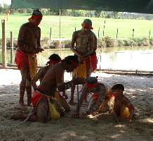 Aboriginies making fire by rubbing sticks